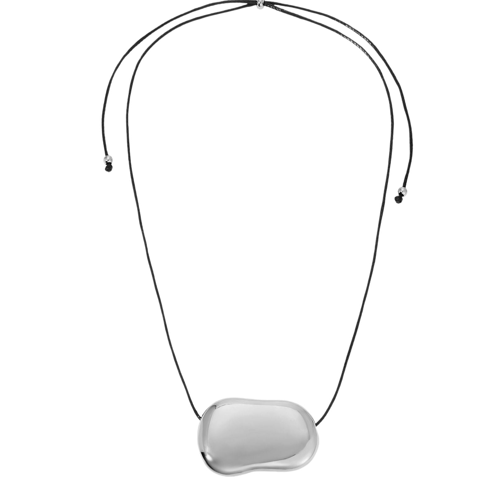 A silver pendant necklace with a rounded bean pendant attached to an adjustable black cord. Refined, wearable statements that elevate the everyday. Sloane corded pendant necklace by Arella The Label — vintage-inspired adjustable cord necklace with silver pendant